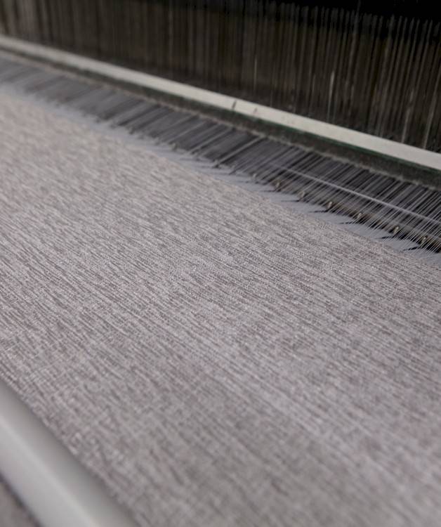 Close up photo of a gray fabric in production